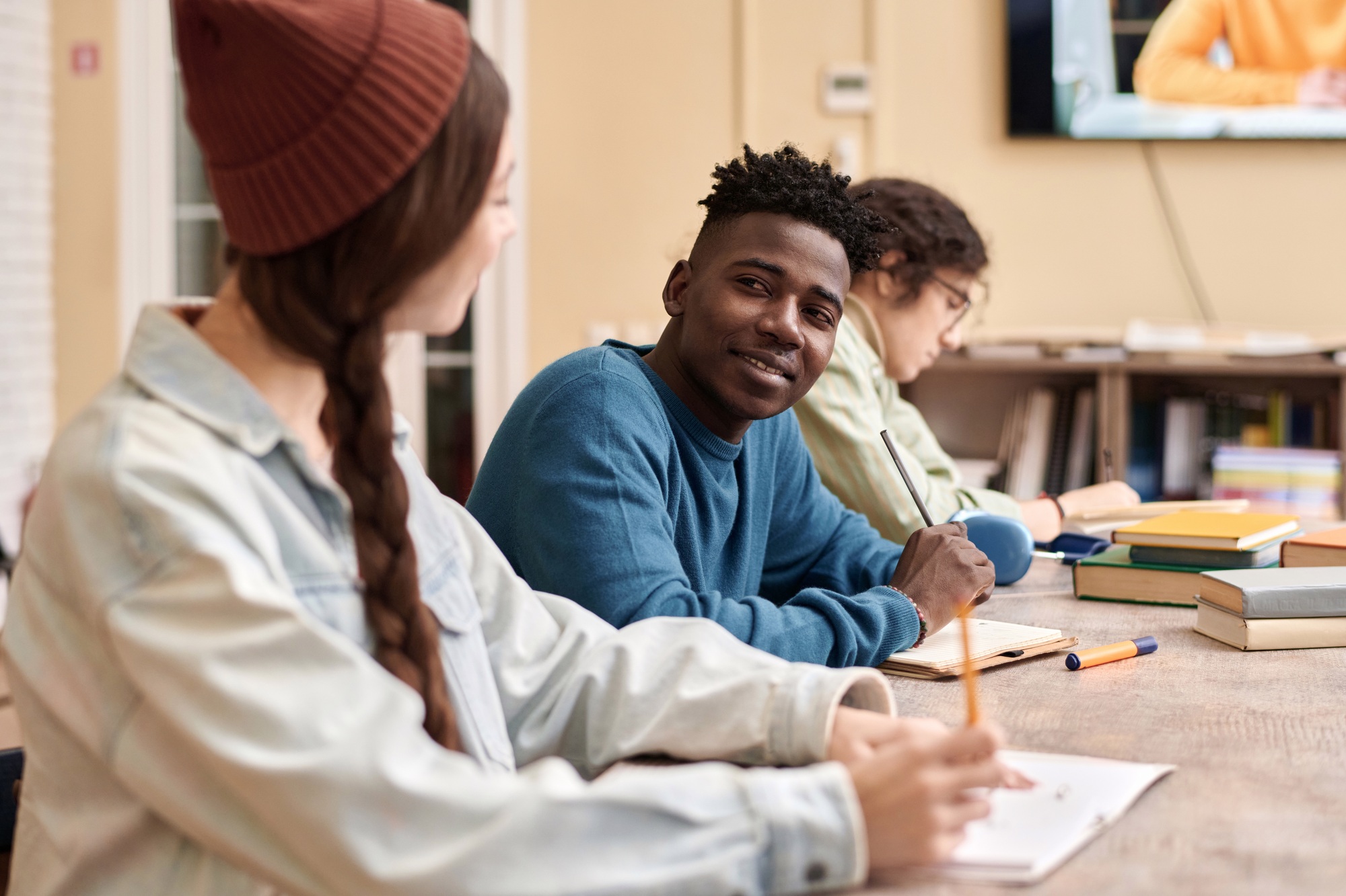 Black Young Man Smiling During Group Study