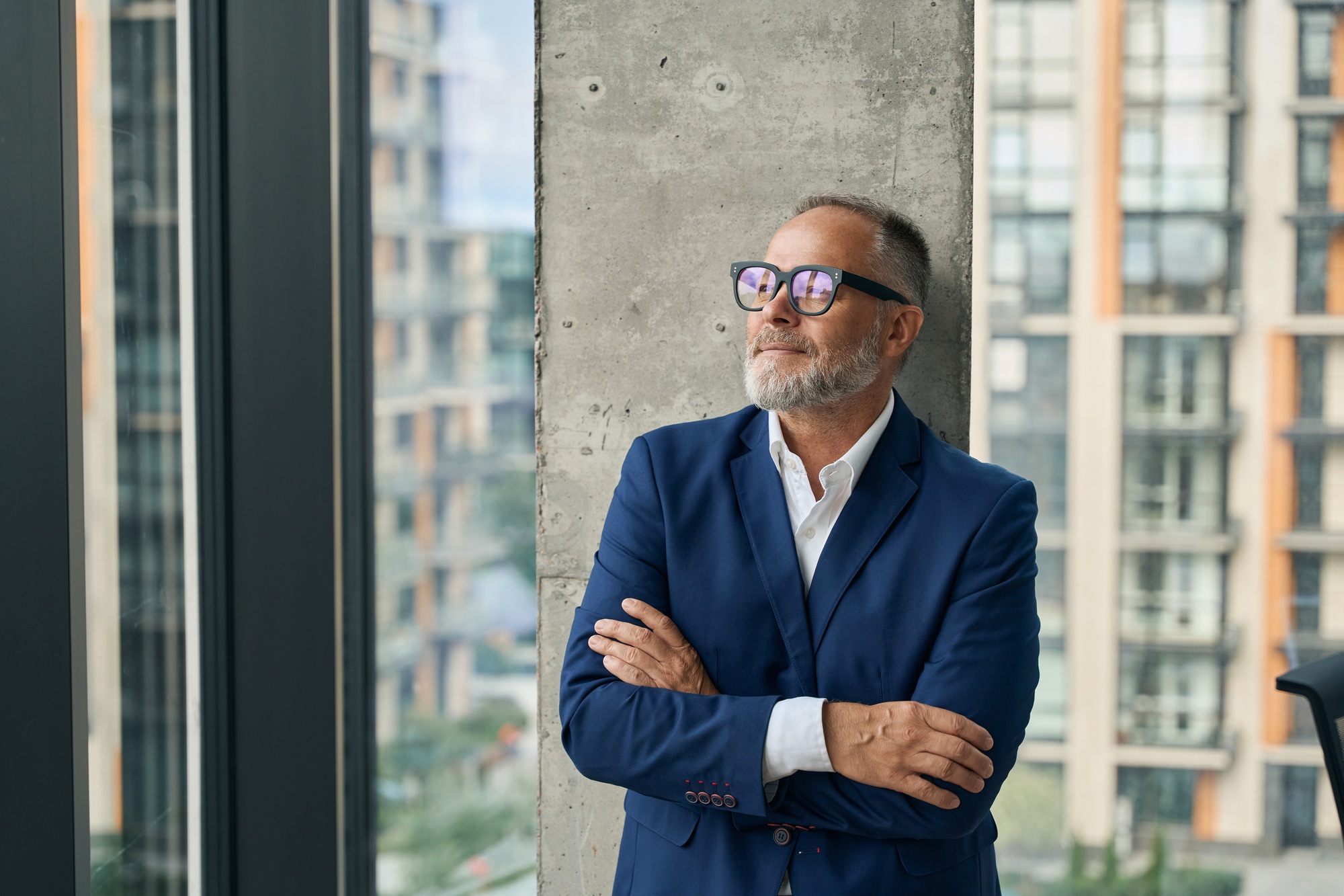 Smiling businessman relaxing during working day on open terrace
